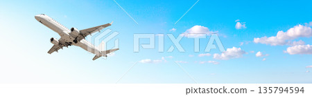 White passenger airplane flying in blue sky with clouds White passenger airplane flying in blue sky with clouds 135794594