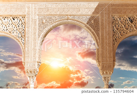 Arches in Islamic (Moorish) style (against the sunset) in Alhambra, Granada, Spain Arches in Islamic (Moorish) style (against the sunset) in Alhambra, Granada, Spain 135794604