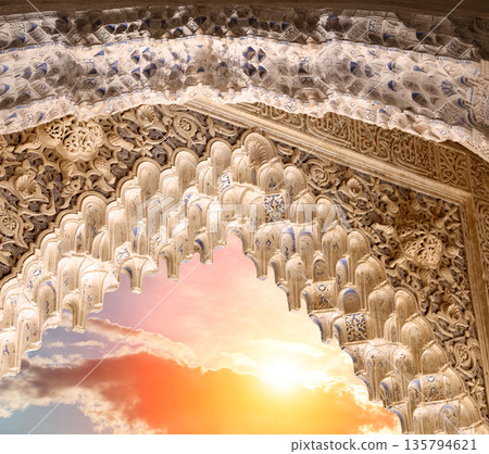 Arches in Islamic (Moorish) style (against the sunset) in Alhambra, Granada, Spain  135794621