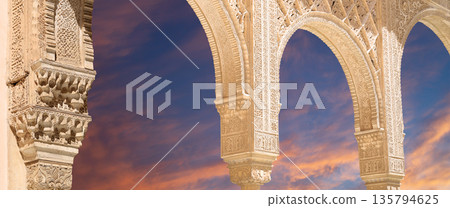 Arches in Islamic (Moorish) style (against the sunset) in Alhambra, Granada, Spain Arches in Islamic (Moorish) style (against the sunset) in Alhambra, Granada, Spain 135794625