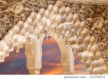 Arches in Islamic (Moorish) style (against the sunset) in Alhambra, Granada, Spain Arches in Islamic (Moorish) style (against the sunset) in Alhambra, Granada, Spain 135794635