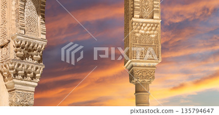 Arches in Islamic (Moorish) style (against the sunset) in Alhambra, Granada, Spain  135794647
