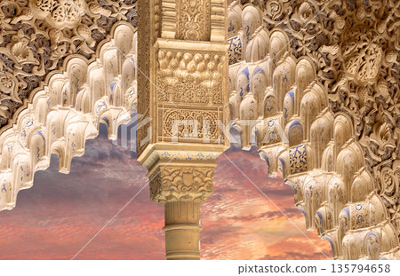 Arches in Islamic (Moorish) style (against the sunset) in Alhambra, Granada, Spain  135794658