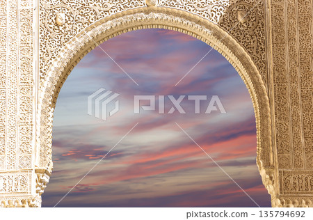 Arches in Islamic (Moorish) style (against the sunset) in Alhambra, Granada, Spain Arches in Islamic (Moorish) style (against the sunset) in Alhambra, Granada, Spain 135794692