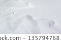 Texture background of undulating winter snow fields 135794768