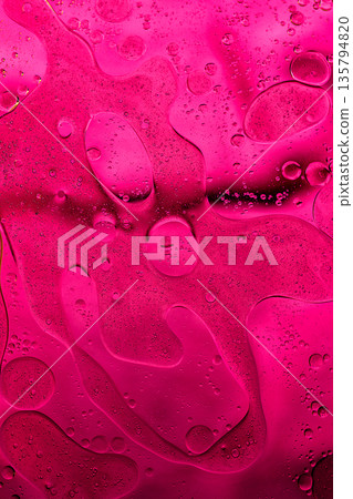 Bright magenta liquid texture with subtle depth, expressive abstract stock image. 135794820