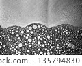 Black and white liquid foam with dense bubbles, abstract macro surface. 135794830