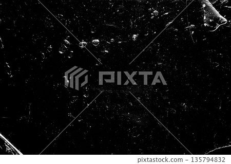 Dark abstract texture with scattered light particles, cinematic and minimal. Dark abstract texture with scattered light particles, cinematic and minimal. 135794832