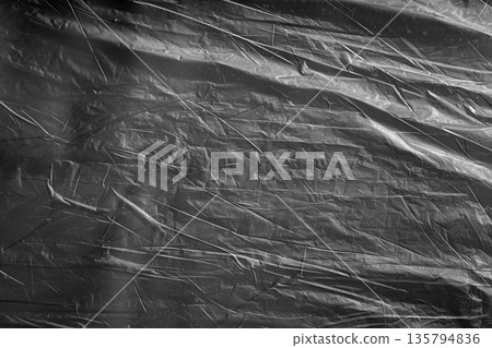 Subtle dark plastic surface with soft wrinkles, minimal abstract background. Subtle dark plastic surface with soft wrinkles, minimal abstract background. 135794836