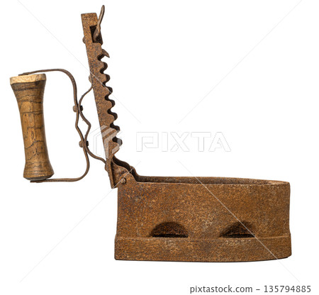 Rusty antique charcoal clothing iron with wooden handle Rusty antique charcoal clothing iron with wooden handle 135794885