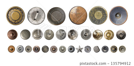 Assortment of metal jeans buttons and rivets Assortment of metal jeans buttons and rivets 135794912