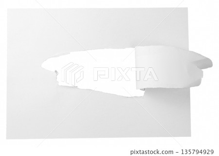 A white paper strip with a natural torn edge, the top part of which is rolled down. A unique design element for banners or price tags with movement. A white paper strip with a natural torn edge, the top part of which is rolled down. A unique design element for banners or price tags with movement. 135794929