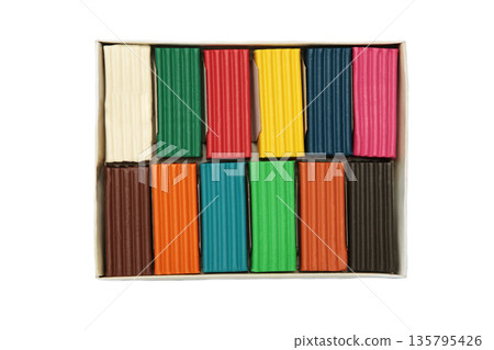 Multi-colored plasticine bricks isolated on white background. Childrens plasticine close-up. 135795426
