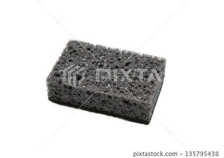 New absorbent black sponge isolated on white background. Black kitchen sponges. New absorbent black sponge isolated on white background. Black kitchen sponges. 135795438