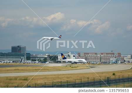 Frankfurt, Germany, July 09 2017: Parallel View of Landing A320 and Taxiing A380 135795653