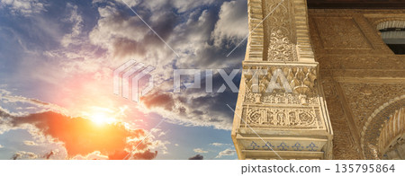 Columns in Islamic (Moorish) style in Alhambra (against the sunset), Granada, Spain Columns in Islamic (Moorish) style in Alhambra (against the sunset), Granada, Spain 135795864