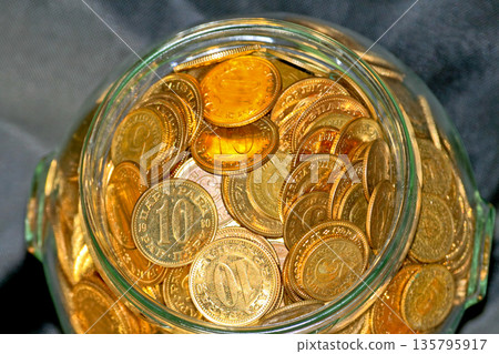 Money in Glass Jar Money in Glass Jar 135795917