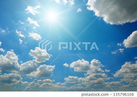 Bright Sun and White Clouds in a Clear Blue Sky Bright Sun and White Clouds in a Clear Blue Sky 135796108