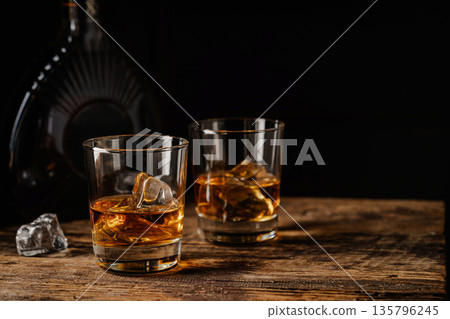 Whiskey with ice in glasses Whiskey with ice in glasses 135796245