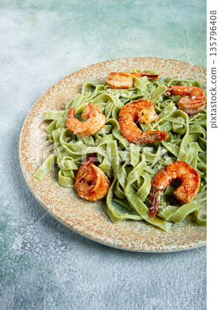 tagliatelle with spinach, in cream sauce, with shrimp, homemade, no people, 135796408