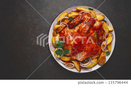 fried, baked chicken, in the oven, with spices, and rustic potatoes, top view, homemade, 135796444