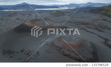 Aerial shot of beautiful volcanic landscape with craters and mountains, Highlands, Iceland Aerial shot of beautiful volcanic landscape with craters and mountains, Highlands, Iceland 135796529