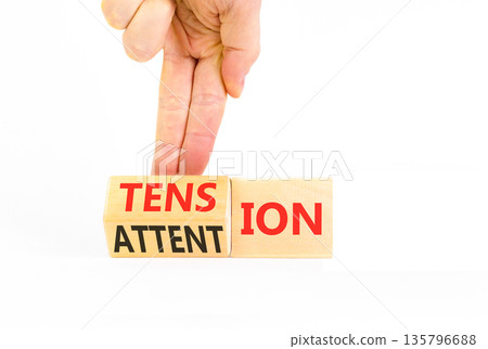 Tension or attention symbol. Concept words Attention or Tension on beautiful wooden blocks. Beautiful white background. Businessman's hand. Business tension or attention concept. Copy space. 135796688