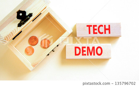 Tech demo symbol. Concept word Tech demo on beautiful wooden blocks. Beautiful white paper background. Beautiful wooden chest with coins. Business tech demo concept. Copy space. Tech demo symbol. Concept word Tech demo on beautiful wooden blocks. Beautiful white paper background. Beautiful wooden chest with coins. Business tech demo concept. Copy space. 135796702