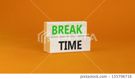 Break time symbol. Concept word Break time on beautiful wooden blocks. Beautiful orange paper background. Business break time concept. Copy space. 135796716