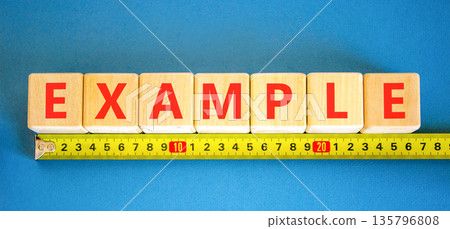 Example examples symbol. Concept word Example on beautiful wooden blocks. Beautiful blue background. Beautiful yellow ruler. Business example examples concept. Copy space. Example examples symbol. Concept word Example on beautiful wooden blocks. Beautiful blue background. Beautiful yellow ruler. Business example examples concept. Copy space. 135796808