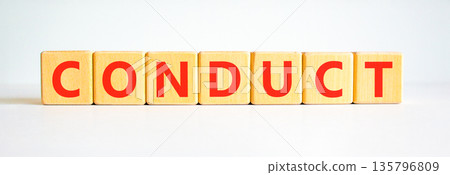 Conduct symbol. Concept word Conduct on beautiful wooden blocks. Beautiful white background. Business conduct concept. Copy space. Conduct symbol. Concept word Conduct on beautiful wooden blocks. Beautiful white background. Business conduct concept. Copy space. 135796809