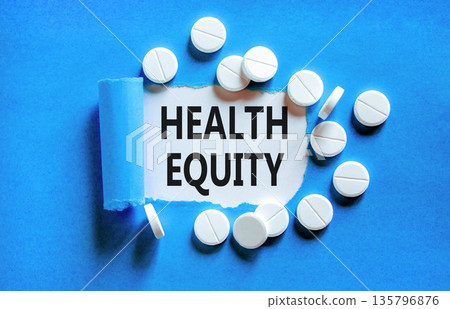 Health equity symbol. Concept words Health equity on beautiful white paper. White pills tablets. Beautiful blue background. Medical healthy lifestyle health equity concept. Health equity symbol. Concept words Health equity on beautiful white paper. White pills tablets. Beautiful blue background. Medical healthy lifestyle health equity concept. 135796876