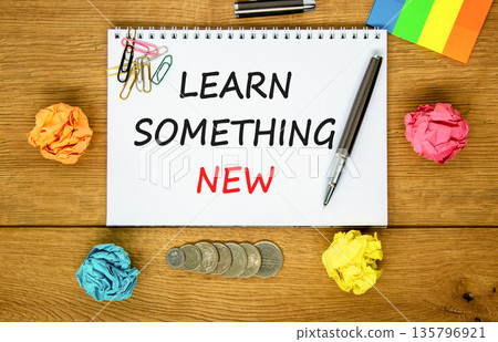 Learn something new symbol. Concept words Learn something new on beautiful white note. Black pen. Beautiful wooden background. Business motivational lifestyle learn something new concept. Copy space. 135796921