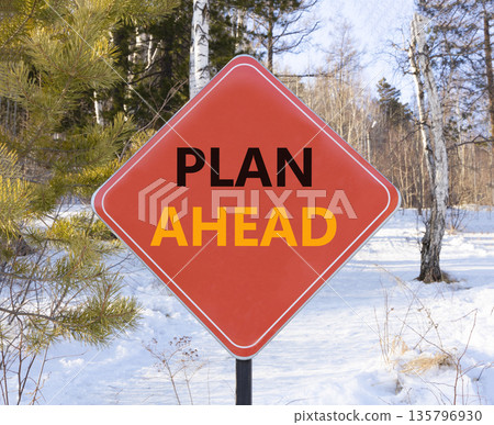 Plan ahead symbol. Concept word Plan ahead on beautiful red road sign. Beautiful snow winter forest background. Business plan ahead concept. Copy space. Plan ahead symbol. Concept word Plan ahead on beautiful red road sign. Beautiful snow winter forest background. Business plan ahead concept. Copy space. 135796930
