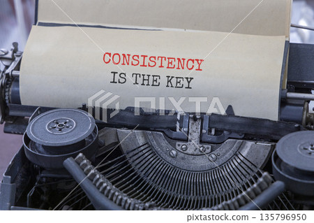 Consistency is the key symbol. Concept words Consistency is the key typed on beautiful old retro typewriter. Beautiful white paper background. Business consistency is the key concept. Copy space. 135796950