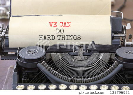 Support, help we can do hard things symbol. Concept words We can do hard things typed on beautiful old retro typewriter. Beautiful white background. Business we can do hard things concept. Copy space. 135796951