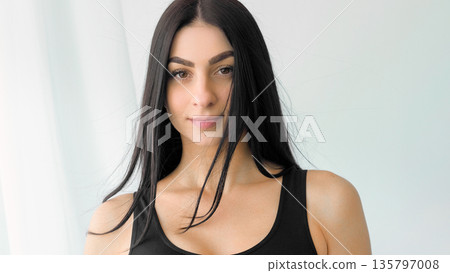 Natural model. Young glamour portrait. Female with long hair casually standing on wind. Attractive chic healthy face skin isolated on white. 135797008