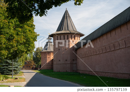 Suzdal Kremlin wall with towers rising above surrounding landscape Suzdal Kremlin wall with towers rising above surrounding landscape 135797139