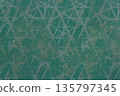 Dark teal textile with white geometric line pattern and gold accents 135797345