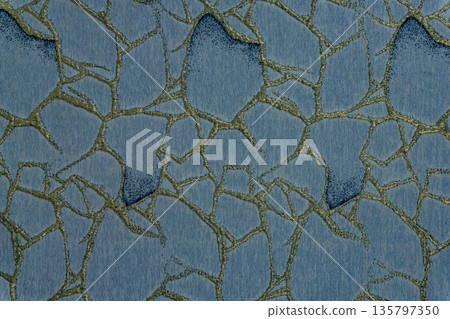 Deep blue and gold textile texture with mosaic web pattern 135797350