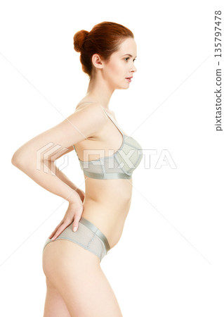 Attractive slim woman in grey matching underwear 135797478