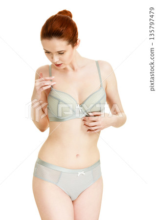 Attractive slim woman in grey matching underwear 135797479