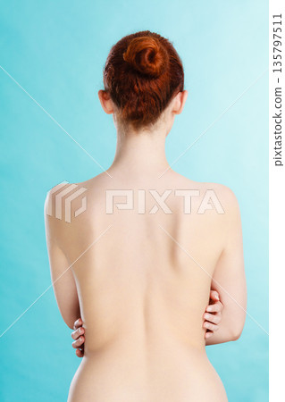 Young woman with naked back 135797511