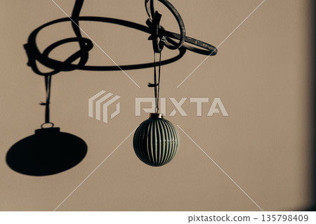 Ambient Realism in this contemporary Christmas decor shot, focusing on shadow play. This image embodies quiet luxury and conscious living trends. 135798409