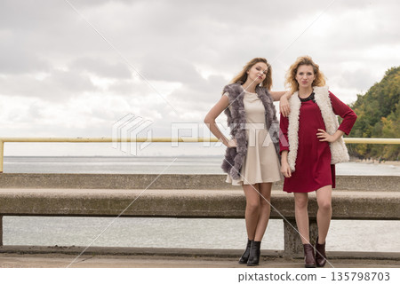 Two fashionable women outdoor Two fashionable women outdoor 135798703