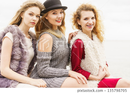 Three fashionable woman outdoor Three fashionable woman outdoor 135798705