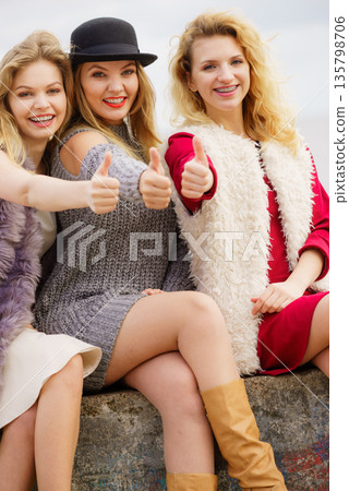 Three fashionable woman outdoor Three fashionable woman outdoor 135798706