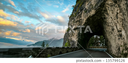 A scenic road in the Italian Alps. Hiking trails in the Dolomite Alps. High quality photo A scenic road in the Italian Alps. Hiking trails in the Dolomite Alps. High quality photo 135799126