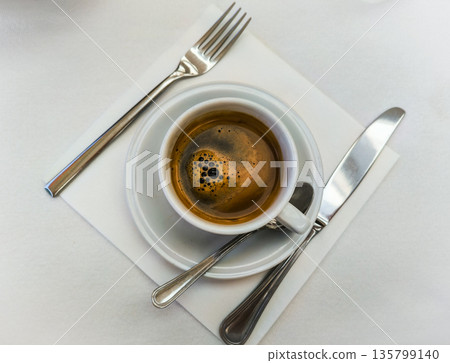 Fresh morning coffee on the table. Relaxation before the working day. Morning routine. High quality photo 135799140