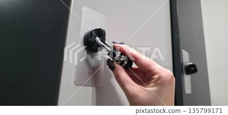 A lock with a code mechanism. Protection of personal belongings using a lock with a code mechanism in lockers. High quality photo A lock with a code mechanism. Protection of personal belongings using a lock with a code mechanism in lockers. High quality photo 135799171
